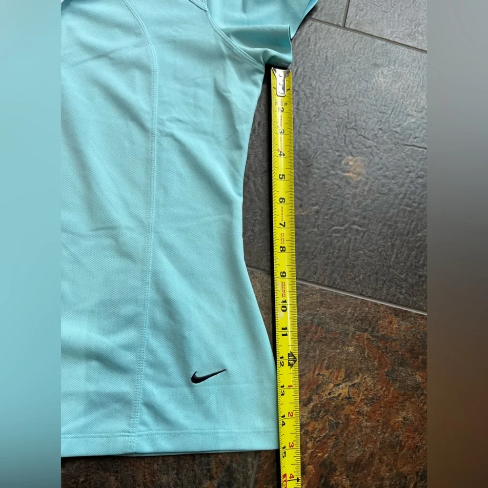 Women’s Nike Sphere fit dry pull over V neck short sleeve. Light blue. Medium